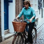 woman riding on bicycle on the street